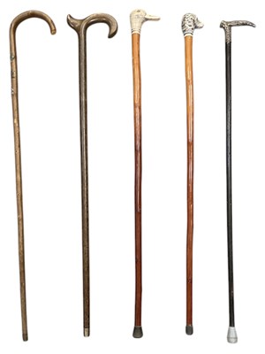 Lot 316 - Five walking sticks, two with painted wooden...