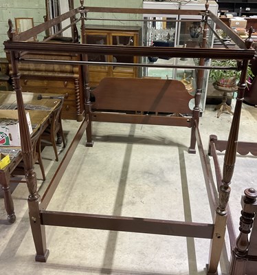 Lot 392 - A mahogany four poster bed, with shaped...