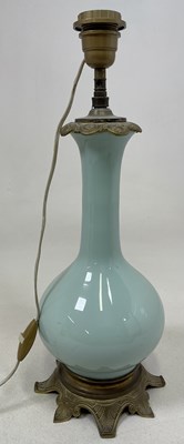 Lot 352 - A Chinese very pale celadon glazed baluster...