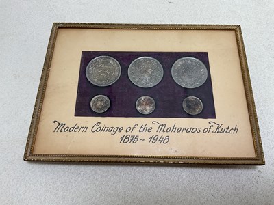 Lot 1385 - A cased display of six Maharaos of Kutch coins,...