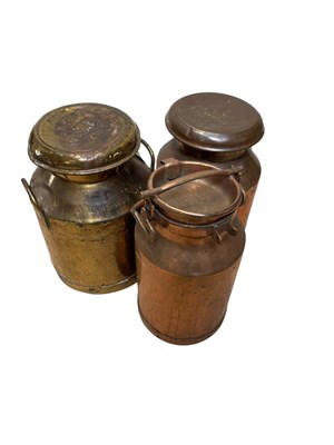 Lot 352 - Three vintage milk churns including a brass...