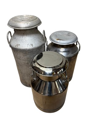 Lot 383 - Three vintage milk churns comprising two...