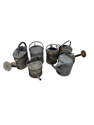 Lot 413 - Six vintage galvenised watering cans,...