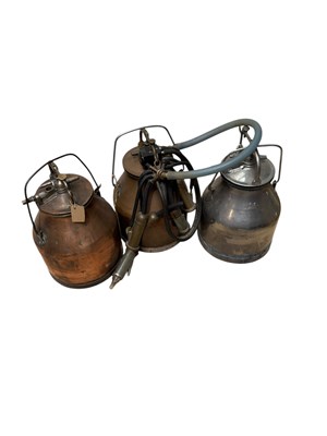 Lot 385 - Three vintage milk churns including a copper...