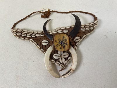 Lot 32 - A Papua New Guinea shell adorned and woven...