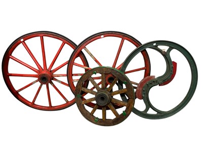 Lot 369 - Three vintage wooden cart wheels and a metal...