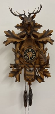 Lot 336 - A German cuckoo clock, circa 1960, with stag...