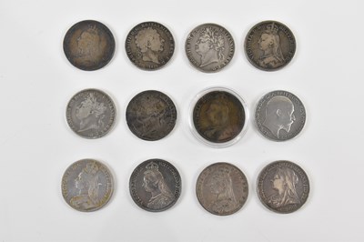 Lot 652 - Twelve George III and later silver crowns...