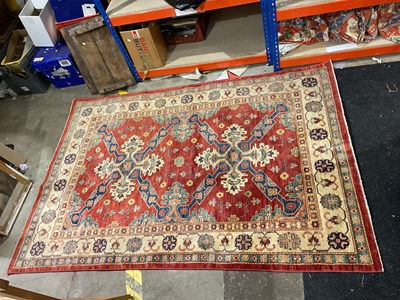 Lot 331 - Two Eastern style rugs with red and beige...