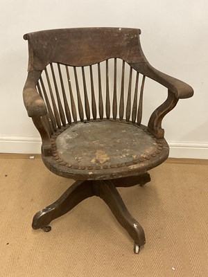 Lot 484 - A 19th century oak and leather swivel desk...