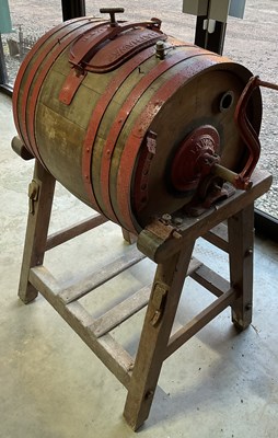 Lot 371 - An antique butter churn on stand with red...