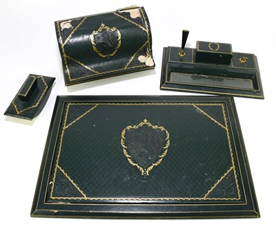 Lot 152 - A green leather five piece desk set comprising...