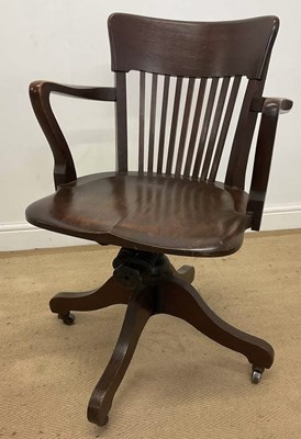 Lot 432 - An early 20th century oak swivel office chair,...