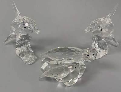 Lot 234 - SWAROVSKI; a pair of orca figures and a third...