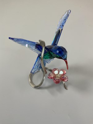 Lot 235 - SWAROVSKI; a coloured glass figure of a...