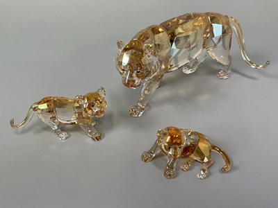 Lot 238 - SWAROVSKI ; a tigress and two cubs with...