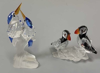 Lot 243 - SWAROVSKI; a group of two puffins and a group...