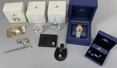 Lot 244 - SWAROVSKI; a group of items including a pair...