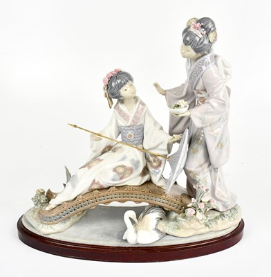 Lot 519 - LLADRO; a large figure group representing two...