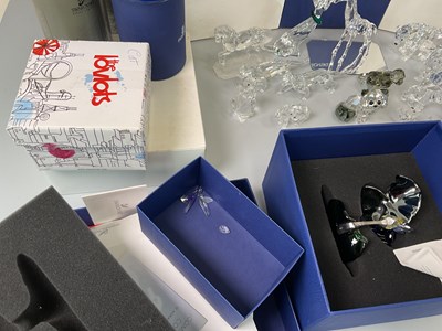 Lot 246 - SWAROVSKI; a group of animal figures including...