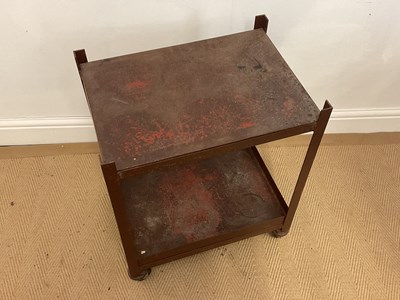 Lot 116 - An industrial two tier metal trolley on...
