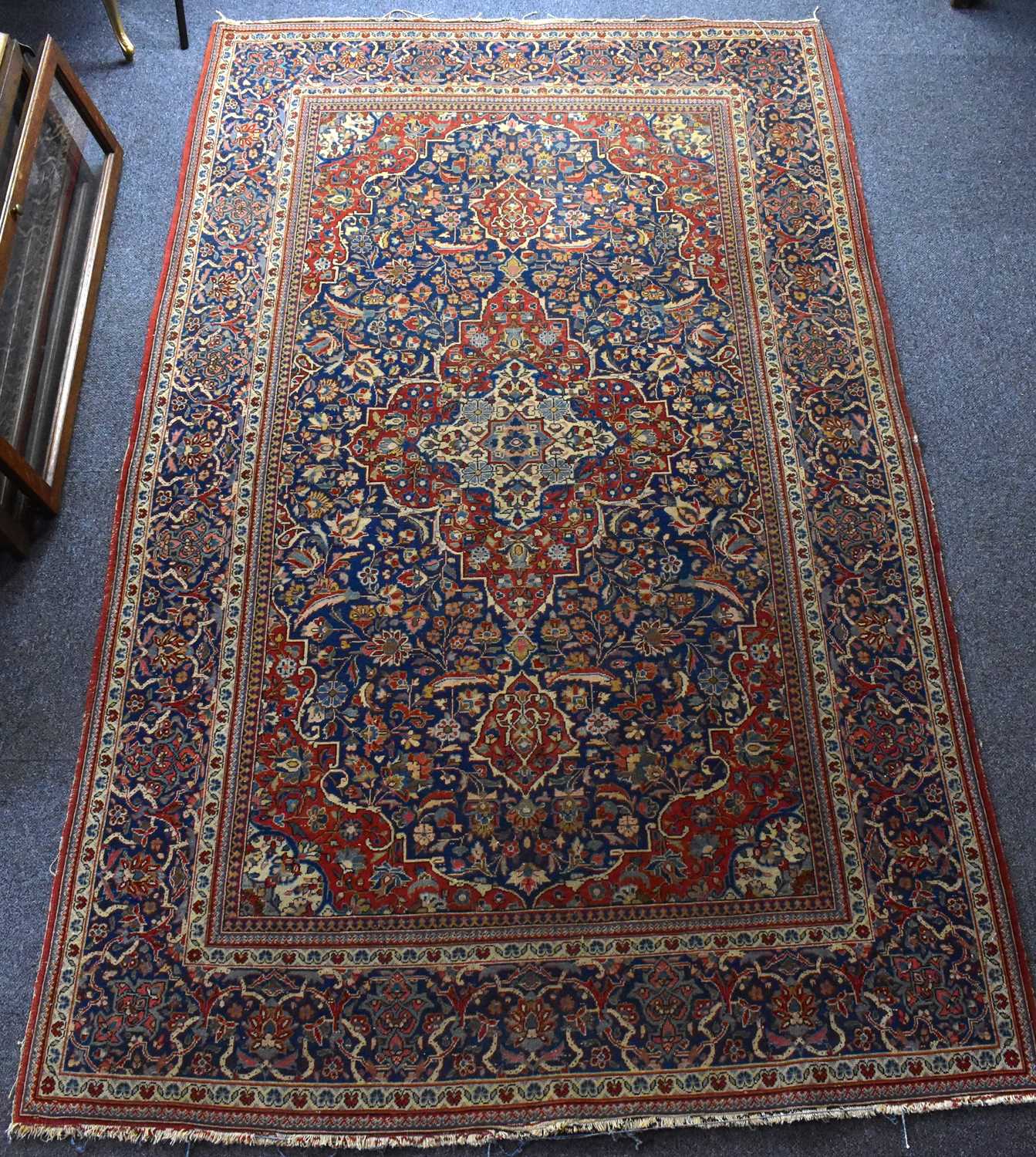 Middle Rugs Lot 89 - A Middle Eastern rug with geometric cascading