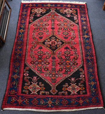 Lot 104 - A vintage 20th century Afghan rug with a...