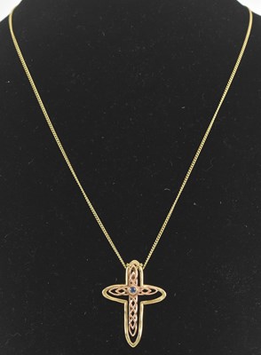 Lot 1448 - CLOGAU; a 9ct yellow gold crucifix pendant set...