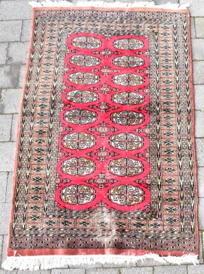 Lot 91 - A Middle Eastern rug with eight rows of two...