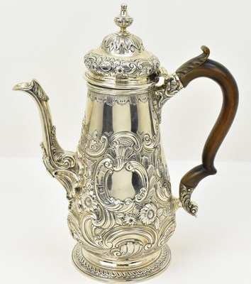 Lot 1095 - A 19th century silver coffee pot, decorated in...