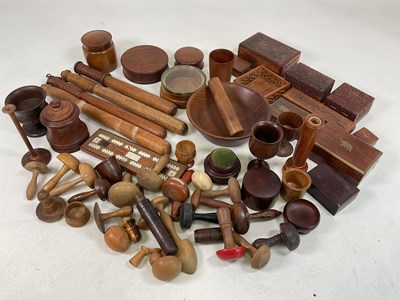 Lot 32 - A quantity of treen wares, including...