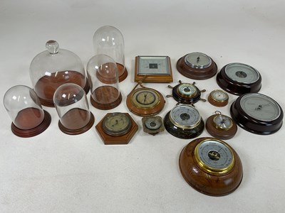 Lot 33 - A quantity of glass domes with wooden bases,...