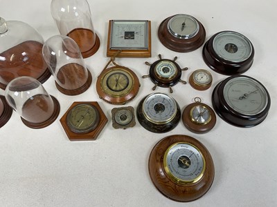 Lot 33 - A quantity of glass domes with wooden bases,...