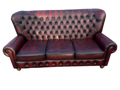 Lot 1072 - A modern maroon leather Chesterfield type...