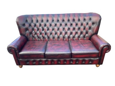 Lot 1073 - A modern maroon leather Chesterfield type...