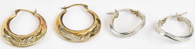 Lot 1426 - Two pairs of 9ct gold earrings comprising a...