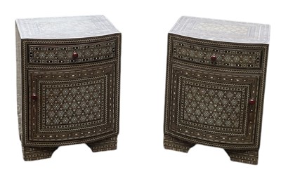 Lot 40 - A pair of Eastern bedside cabinets, profusely...