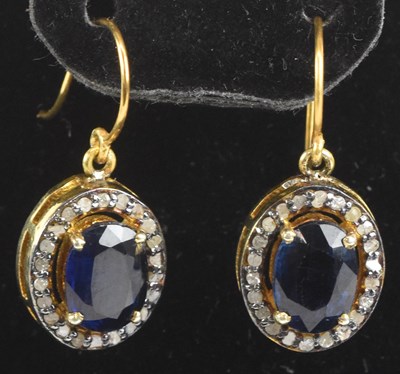 Lot 1427 - A pair of yellow metal diamond and sapphire...