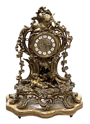 Lot 122 - A modern gilt metal figural mantel clock on...