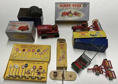 Lot 122 - DINKY; tractors and signs, a 310 farm tractor...