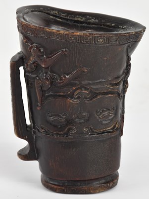 Lot 1004 - A Chinese carved horn libation cup, decorated...