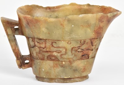 Lot 1017 - A Chinese carved hardstone libation cup, with...