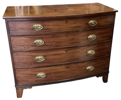 Lot 6 - A Georgian mahogany bowfront chest of four...