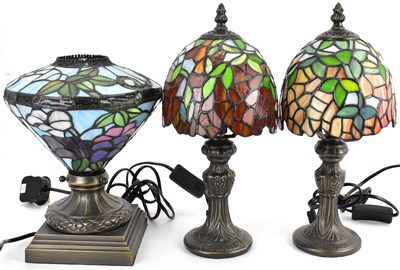 Lot 118 - Three Tiffany-style small table lamps with...