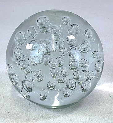 Lot 354 - A modern clear glass ball with bubbles to the...