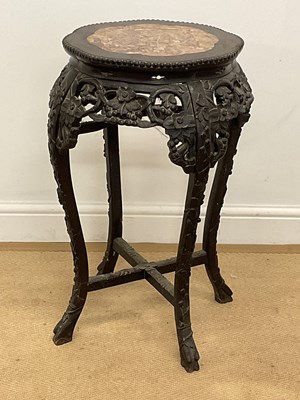 Lot 375 - A Chinese carved hardwood marble topped table,...