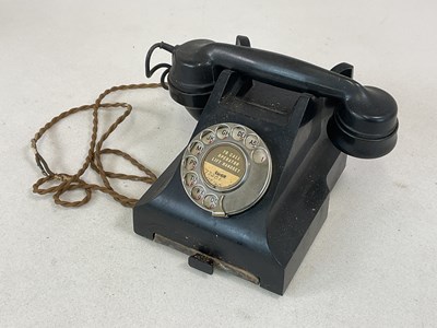 Lot 76 - A black bakelite GPO telephone with pullout...