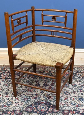 Lot 2930 - An Arts and Crafts rush seated corner chair on...