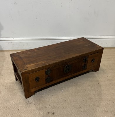 Lot 1084 - A Chinese elm low side table with two panelled...