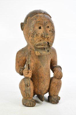 Lot 586 - A carved wooden African ancestor figure,...